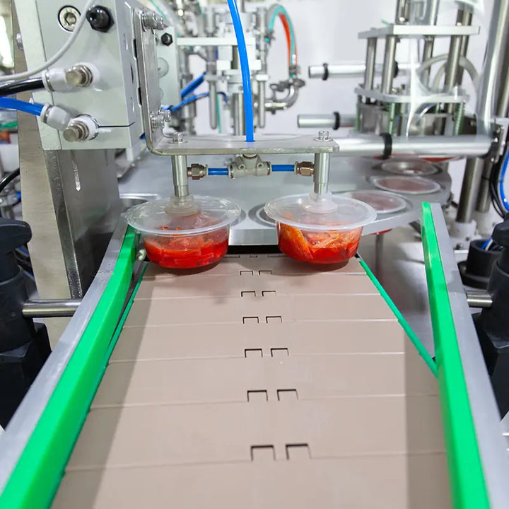 rotary cup filling and sealing machine