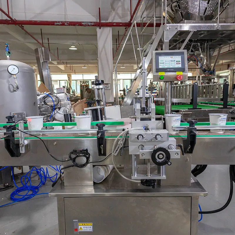 rotary cup filler and sealer
